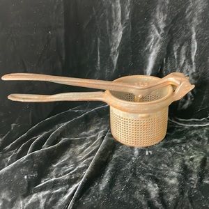 Vintage potato ricer King cup press